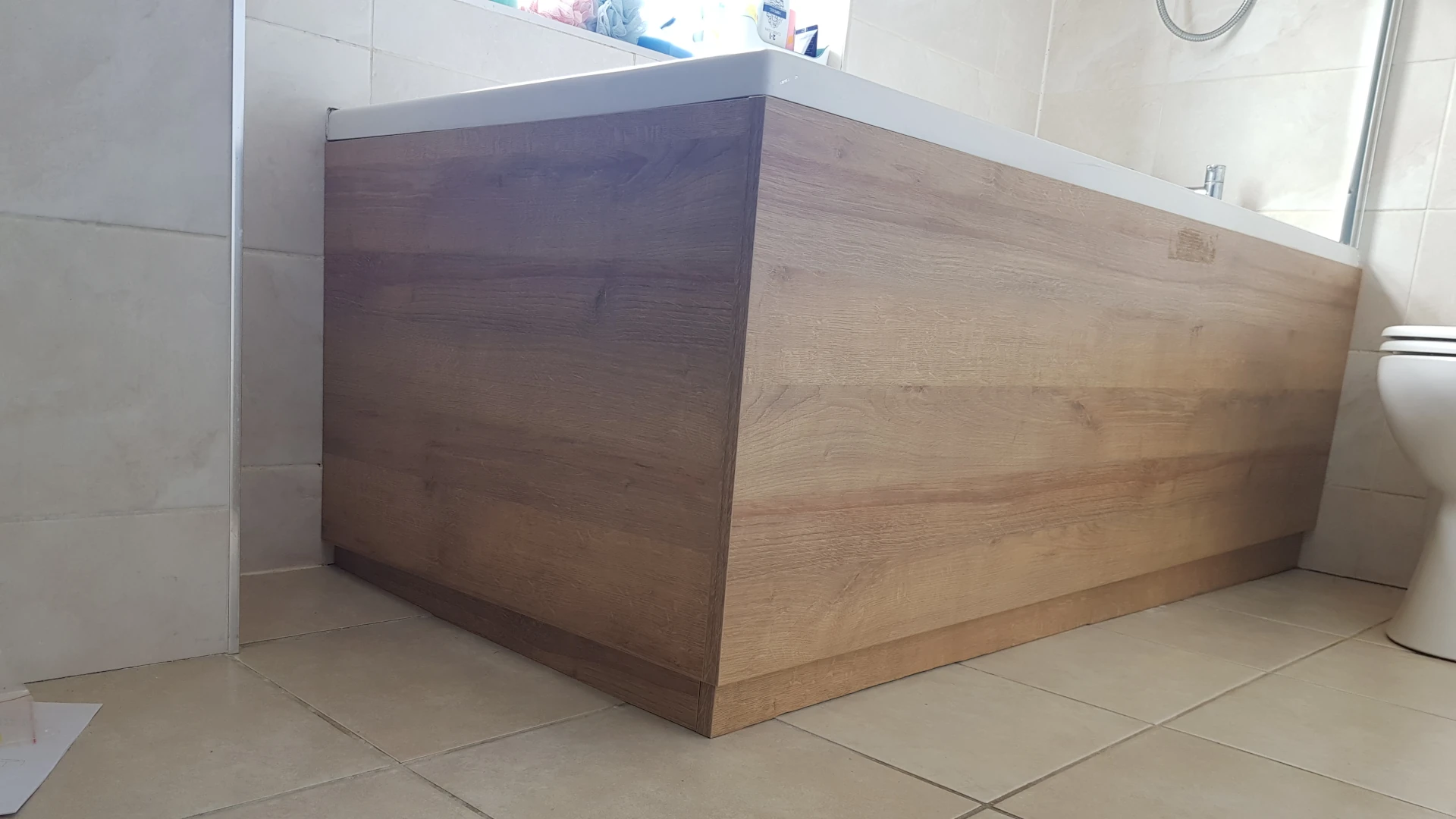 bath with woodgrain effect panels installed